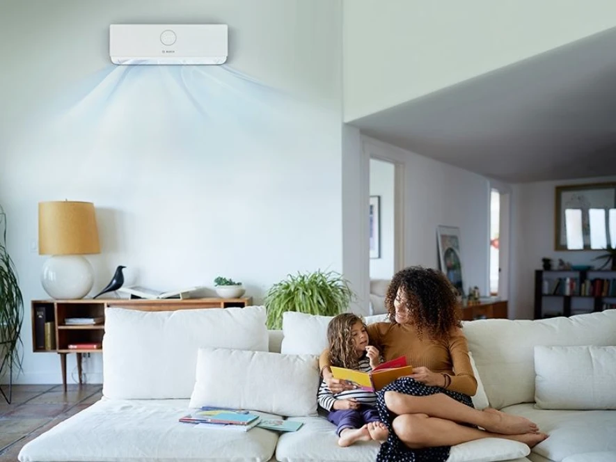 Climate 5000i family sitting on sofa